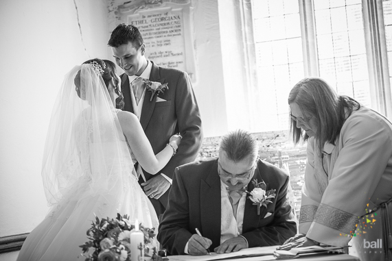 Gloucestershire-Wedding-Photographer-Bride and Groom at Register