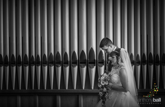 Bride and Groom by Church Organ Pipes